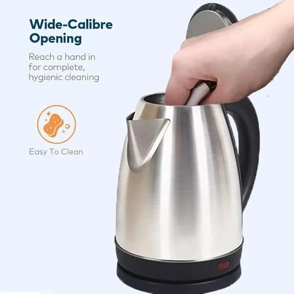 Stainless steel electric kettle with wide-opening feature and hand reaching in to demonstrate ease of cleaning